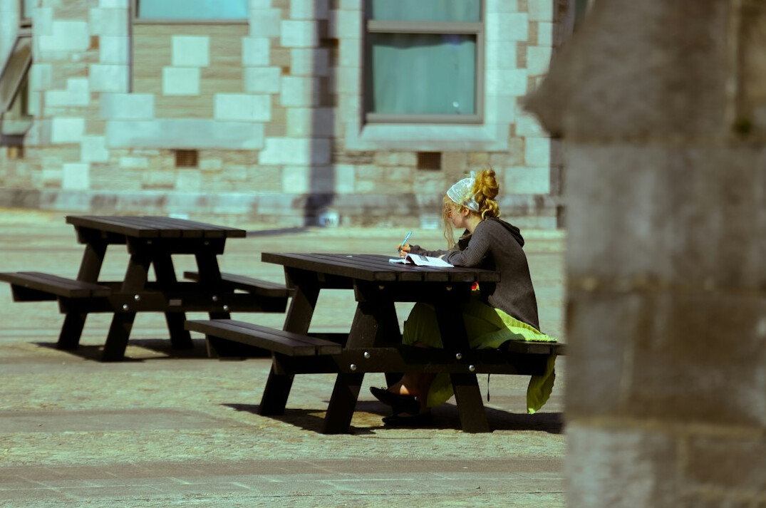 woman writing in notebook